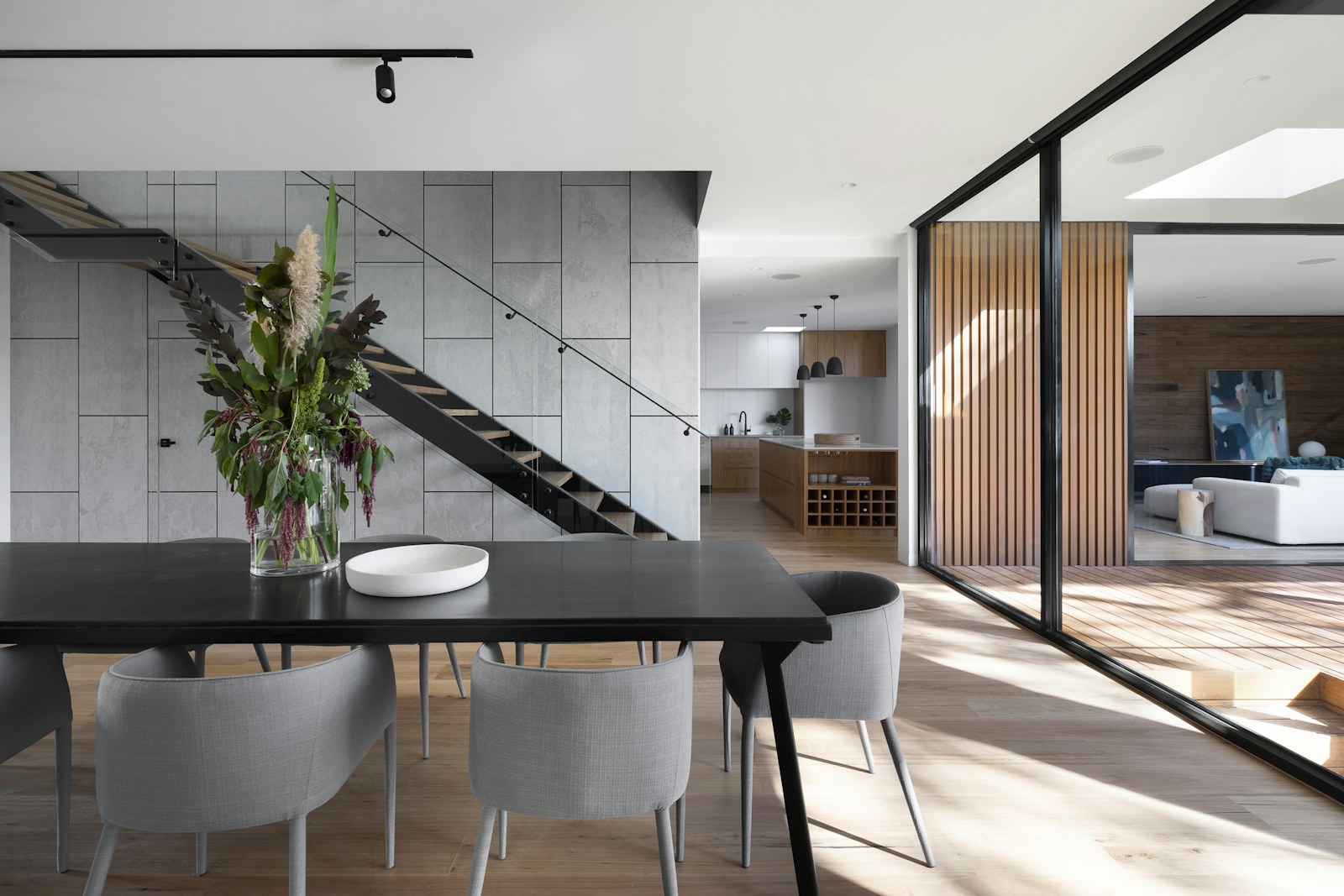 Minimal interior with strong architectural lines and warm timber